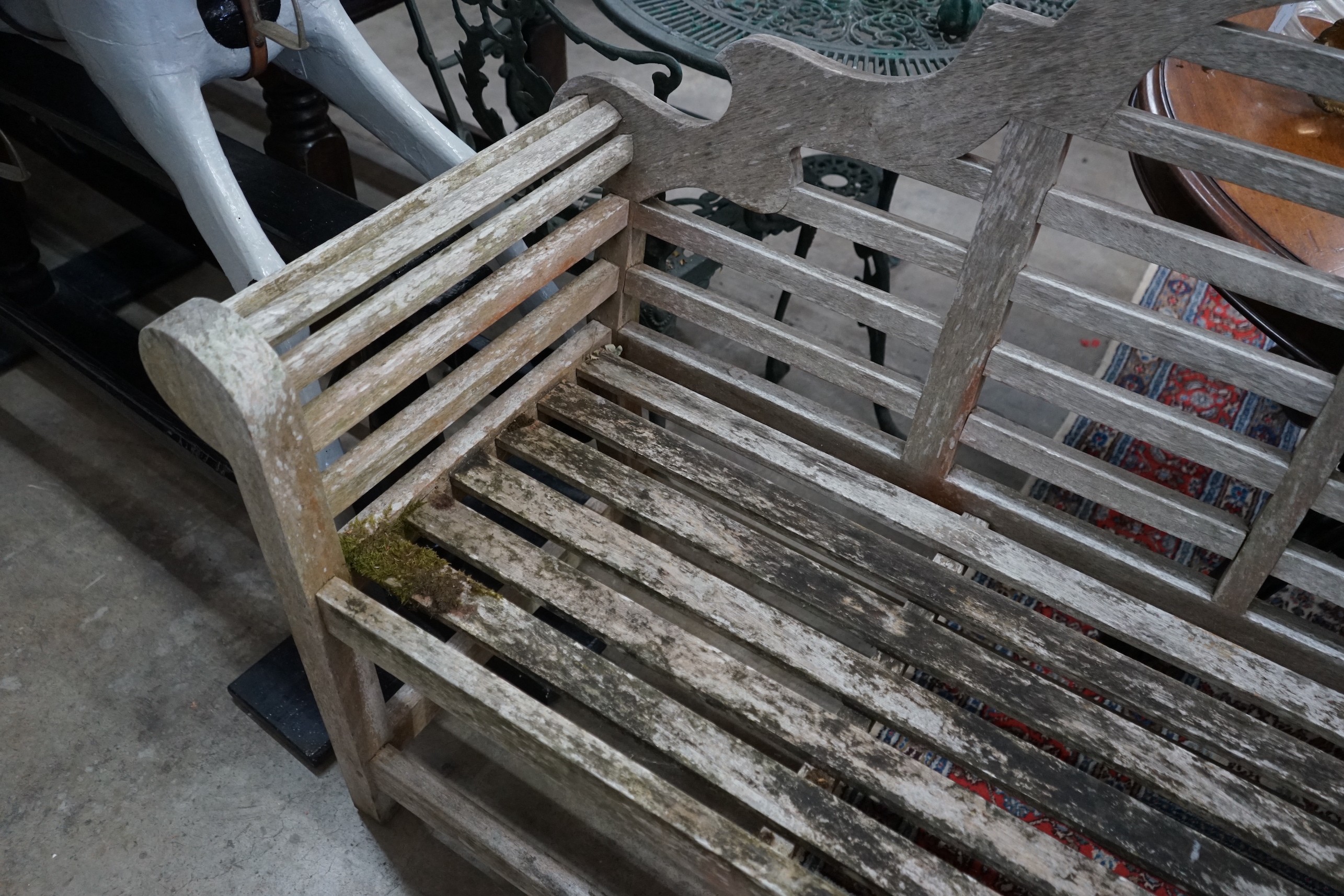 A Lutyens style weathered teak garden bench from 'The Cotswold Collection', width 166cm, depth 52cm, height 105cm